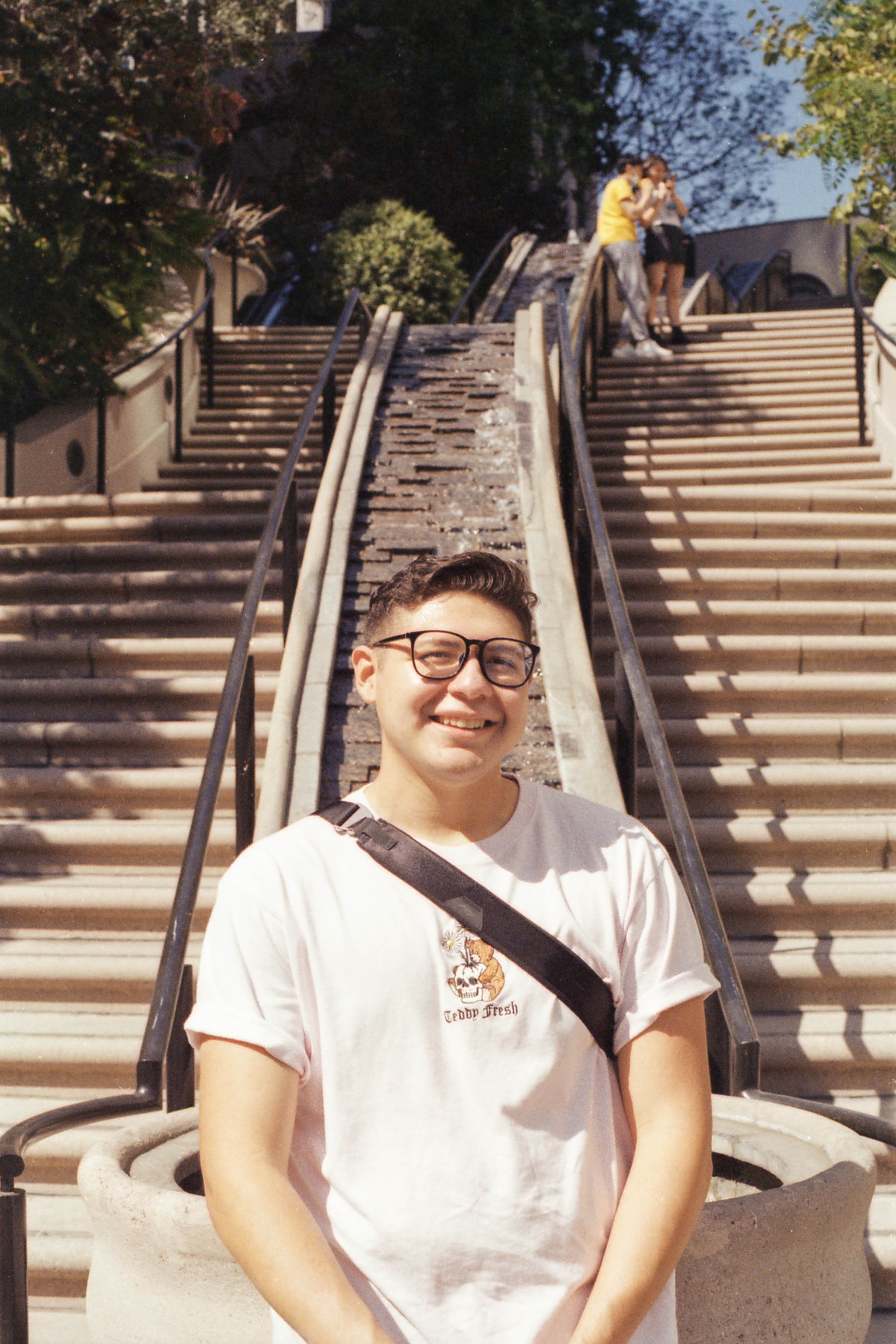 Portrait of a man standing between stairs